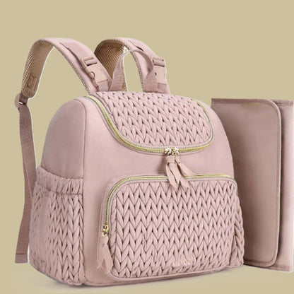 sac a langer rose et le tapis a langer fermeture dorée